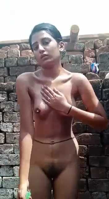 Young Indian Girl Baths In An Open Area